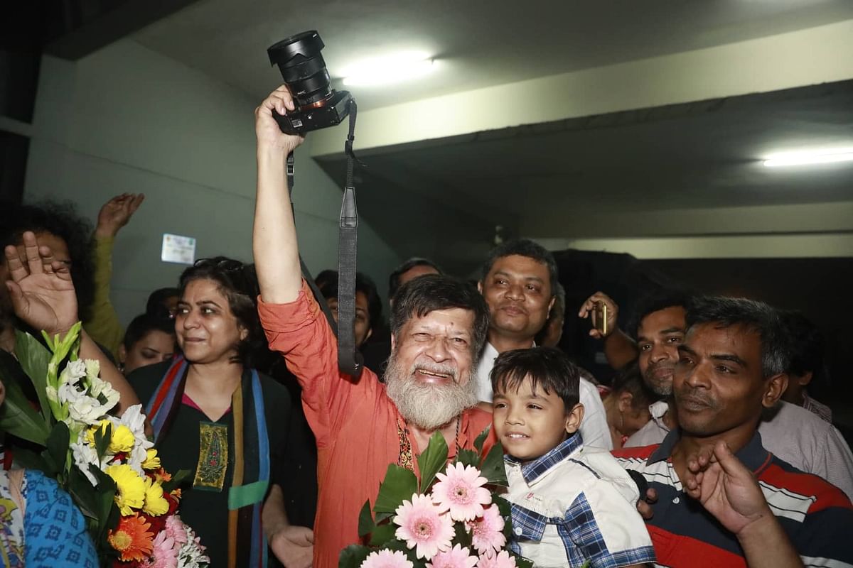 Photojournalist Shahidul Alam holds his camera after being released following a three-month detainment at Dhaka central jail. The picture was taken around 8:30pm on 20 November by Shuvra Kanti Das.