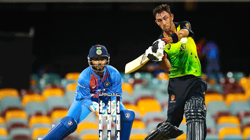 Australia`s batsman Glenn Maxwell (R) hits a shot off the bowling of India`s Krunal Pandya during the T20 international cricket match between Australia and India in Brisbane on 21 November, 2018. Photo: AFP