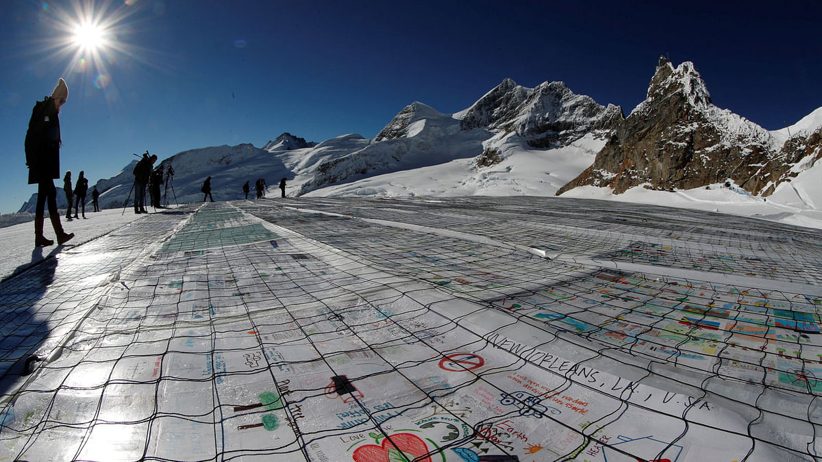 A general view shows 100,000 postcards with messages against climate change, sent by young people from all over the world and stuck together to break the Guinness World Record of the biggest postcard on the Jungfraufirn, the upper part of Europe`s longest glacier, the Aletschgletscher, near Jungfraujoch, Switzerland on 16 November 2018. Reuters File Photo
