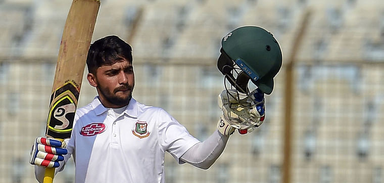 Mominul Haque reacts after scoring a century during the first day of the first Test cricket match between Bangladesh and West Indies at the Zahur Ahmed Chowdhury Stadium in Chittagong on 22 November 2018