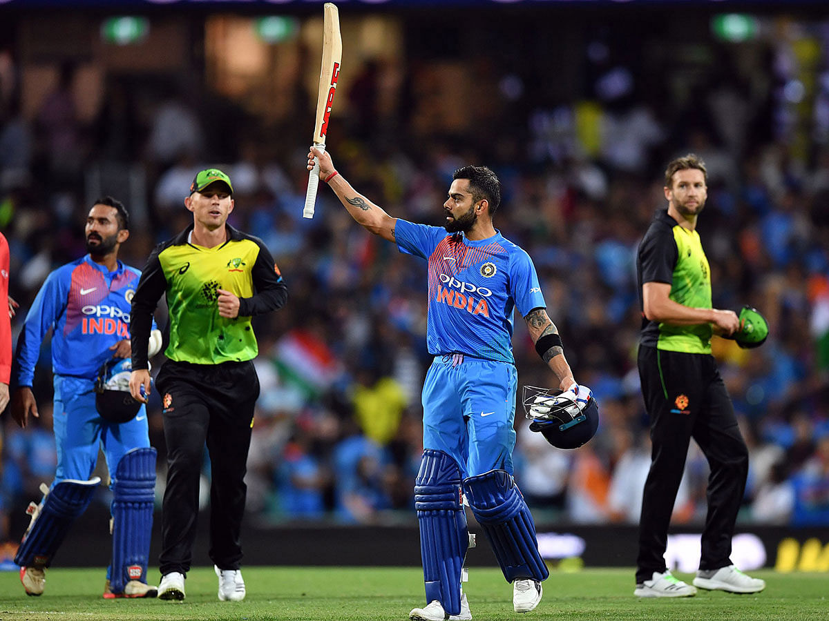 India`s batsman Virat Kohli celebrates his team`s victory against Australia in a T20 international cricket match at the SCG in Sydney on 25 Novembe, 2018. Photo: AFP
