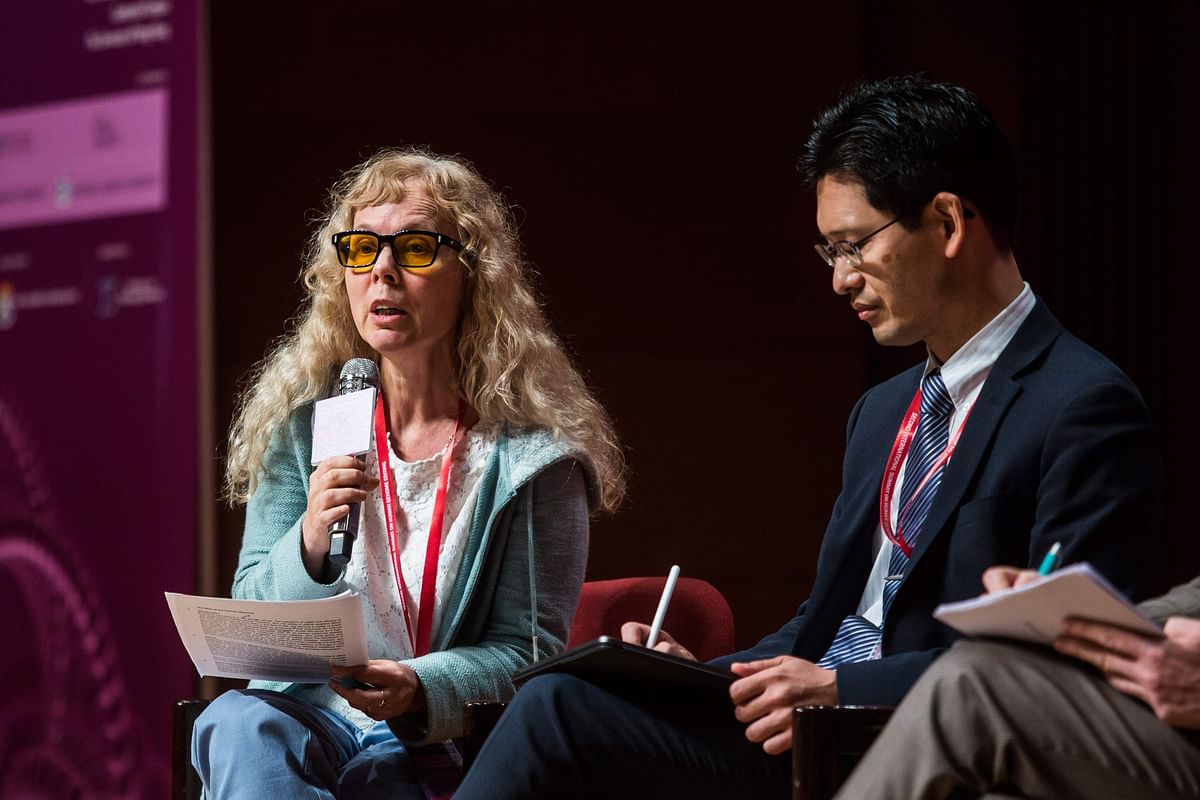 This picture taken on 27 November 2018 shows Margaret Sleeboom-Faulkner from the University of Sussex (L) speaking at the Second International Summit on Human Genome Editing in Hong Kong.Organisers of a conference that has been upended by gene-edited baby revelations are holding their breath as to what the controversial scientist at the centre of the `breakthrough` will say when he takes the stage. Chinese scientist He Jiankui is due to speak on 28 November at a summit of biomedical experts in Hong Kong, just days after publishing claims to have created the world`s first genetically-edited babies. Photo: AFP