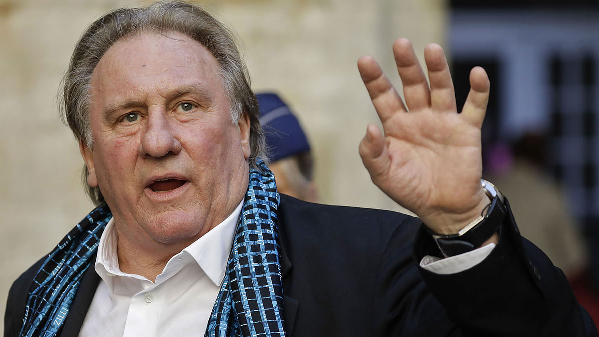 In this file photo taken on 25 June, 2018 French actor Gerard Depardieu waves as he arrives at the Town Hall in Brussels for a ceremony as part of the `Brussels International Film Festival` (BRIFF). Photo: AFP