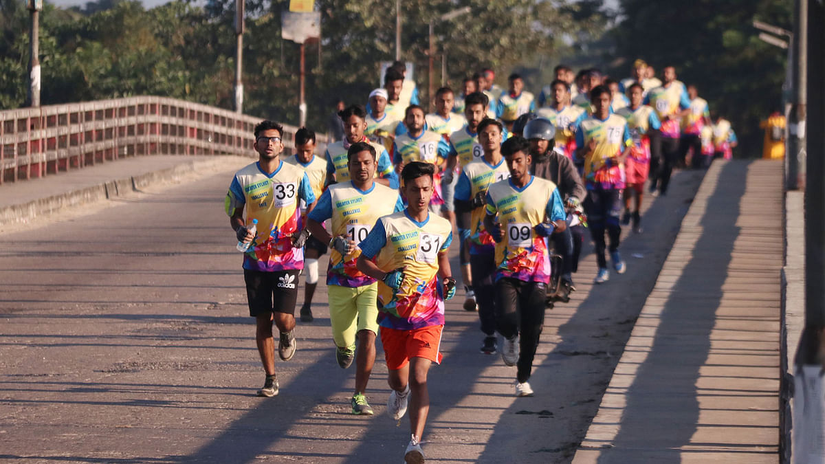 Participants in the `Greater Sylhet Challenge Cycling`, a duathlon ( running leg followed by a cycling leg) competition held in Sylhet on 30 November. A number of 70 males and 9 females joined the competition that spanned from Temukhi via Bypass Road to Rikabi Bazar intersection of the city. Photo: Anis Mahmud