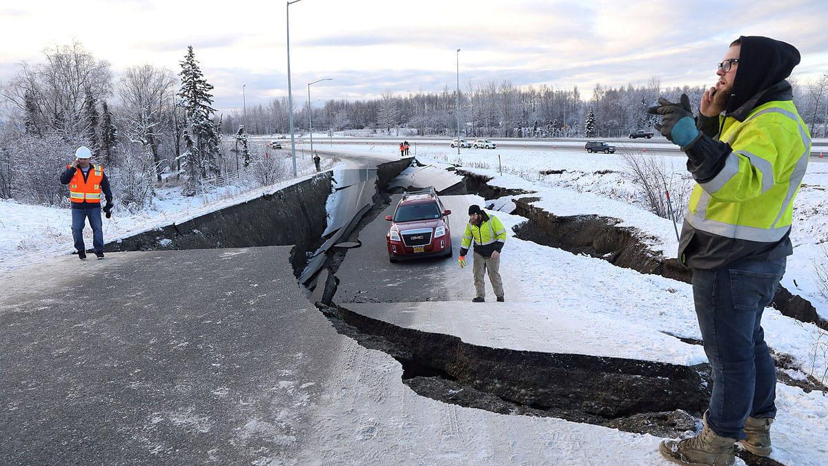 A stranded vehicle lies on a collapsed roadway near the airport after an earthquake in Anchorage, Alaska, US on 30 November. Photo: Reuters