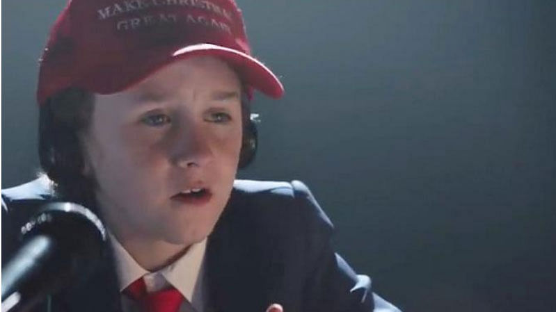 A child wearing a `Make Christmas Great Again` cap speaks in this still image from an undated Air New Zealand advertisement obtained from social media. Photo: Reuters