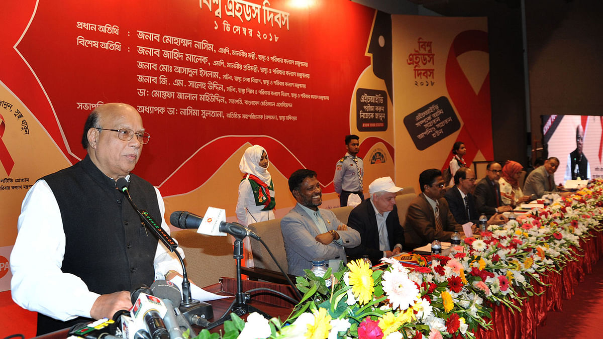 Health minister Mohammad Nasim addresses a programme on World AIDS Day arranged on Saturday by the National AIDS/STD Programme at the auditorium of the Krishibid Institution of Bangladesh, Dhaka. Photo: PID
