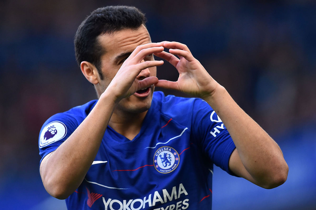 Chelsea`s Spanish midfielder Pedro celebrates after scoring the opening goal of the English Premier League football match between Chelsea and Fulham at Stamford Bridge in London on 2 December 2018. Photo: AFP