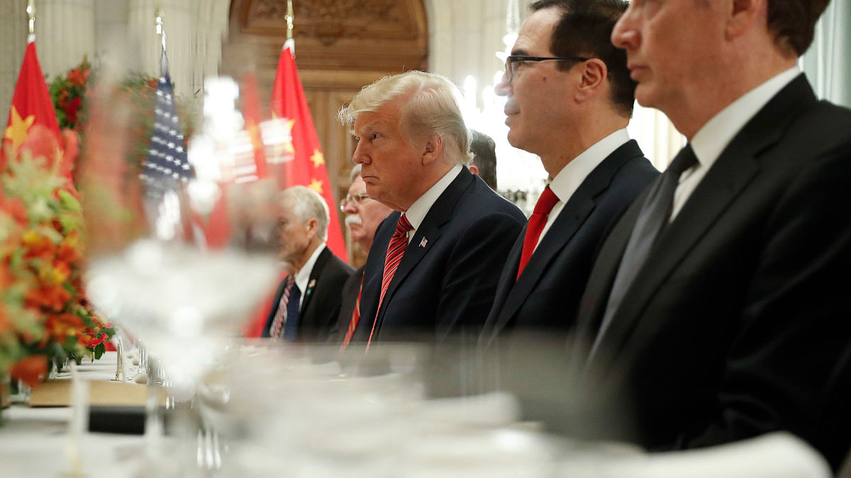 President Donald Trump, centre, and treasury secretary Steve Mnuchin, second from the right, listen to remarks by China`s president Xi Jinping during a bilateral meeting at the G20 Summit, on 1 December. Photo: AP