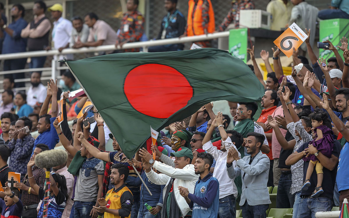 Bangladesh fans cheer during the second day of the second Test cricket match between Bangladesh and West Indies in Dhaka on 1 December 2018. Photo: AFP