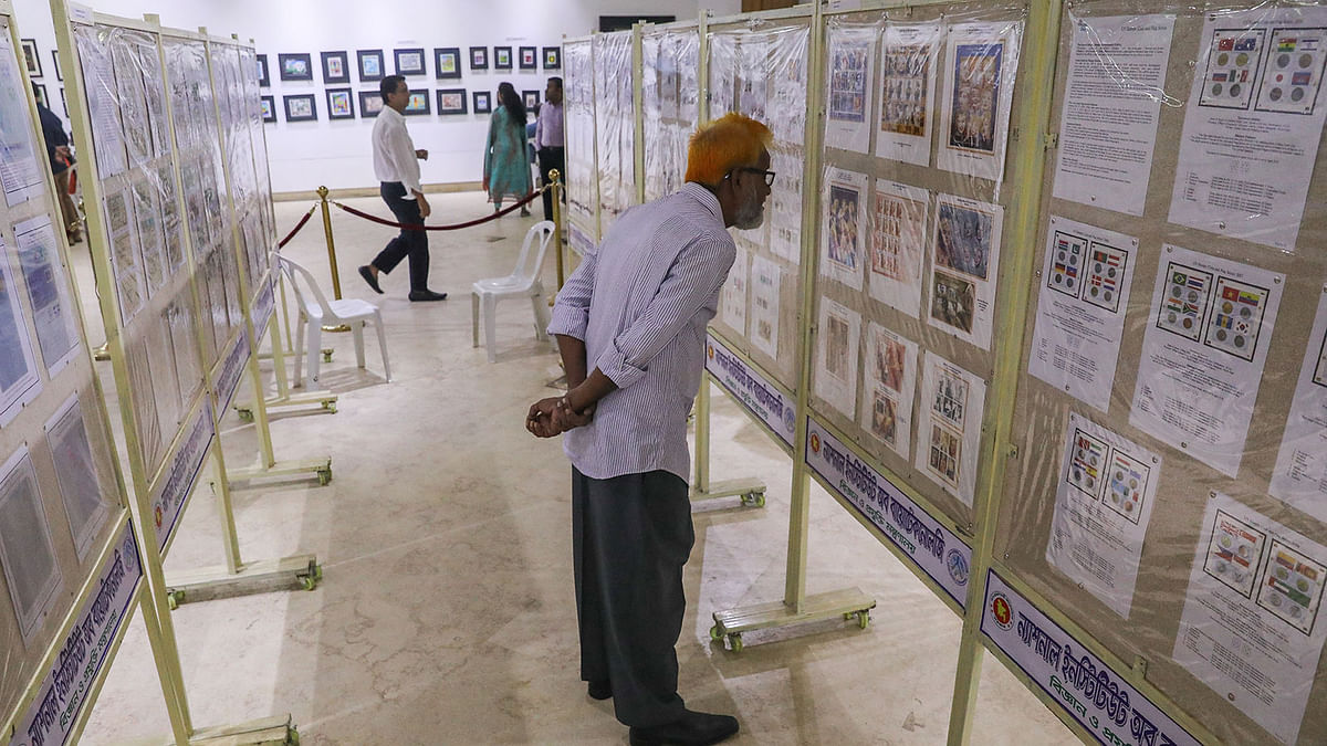 Visitors in a five-day postage stamp show being held at the national museum in the city. Shahbagh, Dhaka, 1 December. Photo: Dipu Malakar