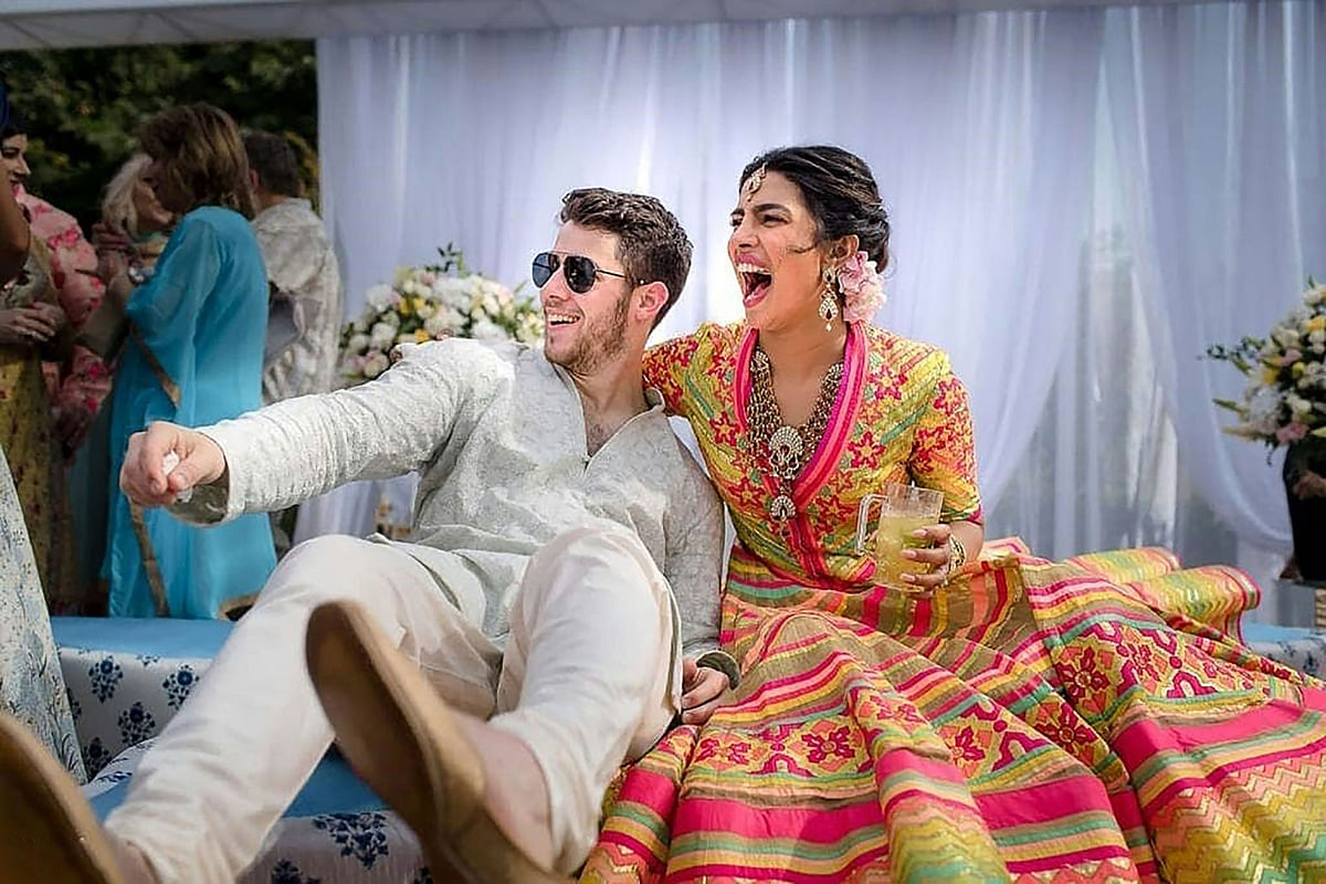 This handout photo released by Raindrop Media on 1 December 2018 shows Bollywood actress Priyanka Chopra (R) and American singer Nick Jonas during their wedding celebration at Umaid Bhawan palace in Jodhpur. Photo: AFP