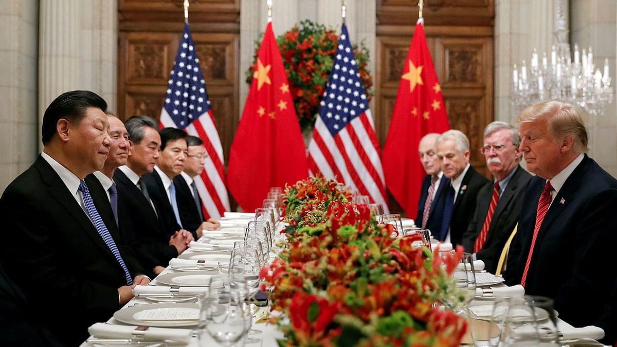 US president Donald Trump, US secretary of state Mike Pompeo, US president Donald Trump`s national security adviser John Bolton and Chinese president Xi Jinping attend a working dinner after the G20 leaders summit in Buenos Aires, Argentina on 1 December. Photo: Reuters