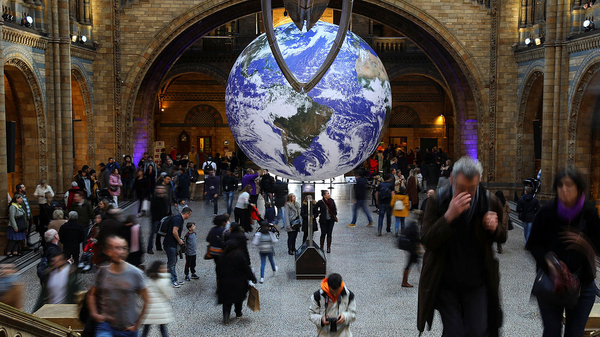 A giant Earth artwork is displayed in the Hintze Hall inside the Natural History Museum in London, Britain, on 30 November 2018. Photo: Reuters