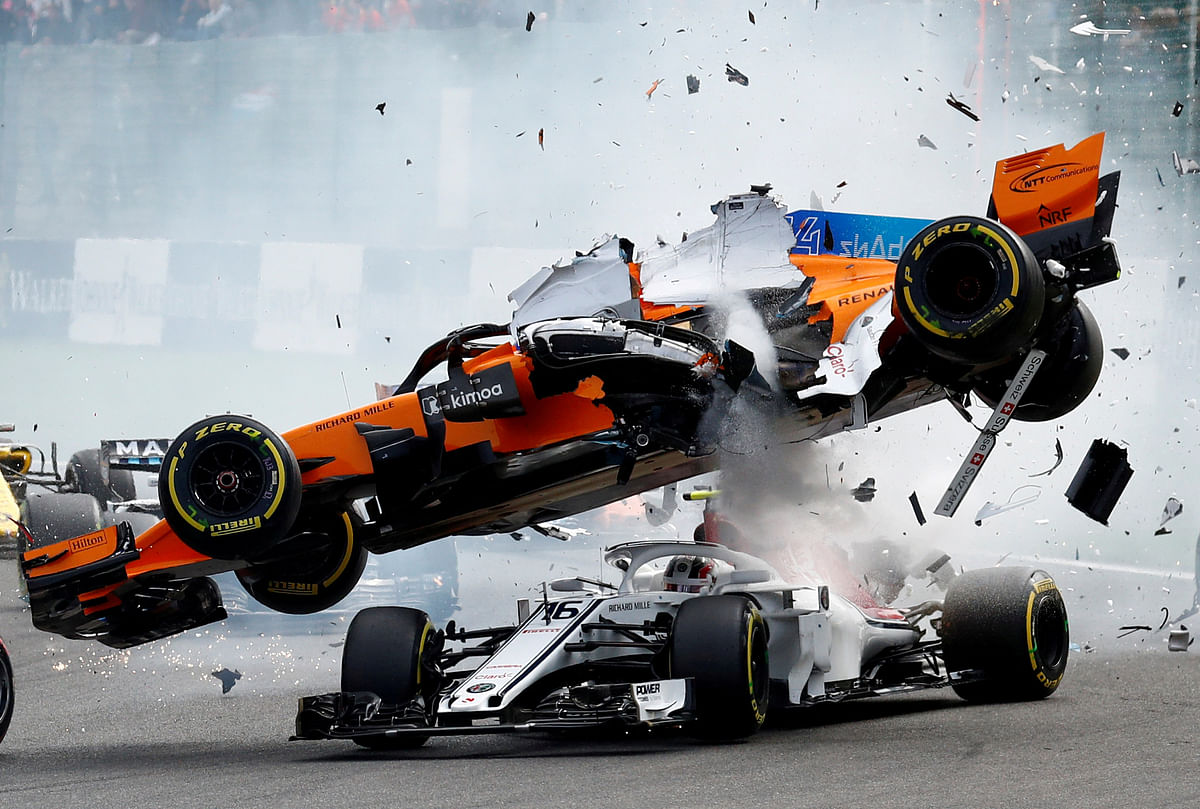 McLaren`s Fernando Alonso and Sauber`s Charles Leclerc crash at the first corner during the Belgian Grand Prixin Stavelot, Belgium, 26 August 2018. Photo: Reuters