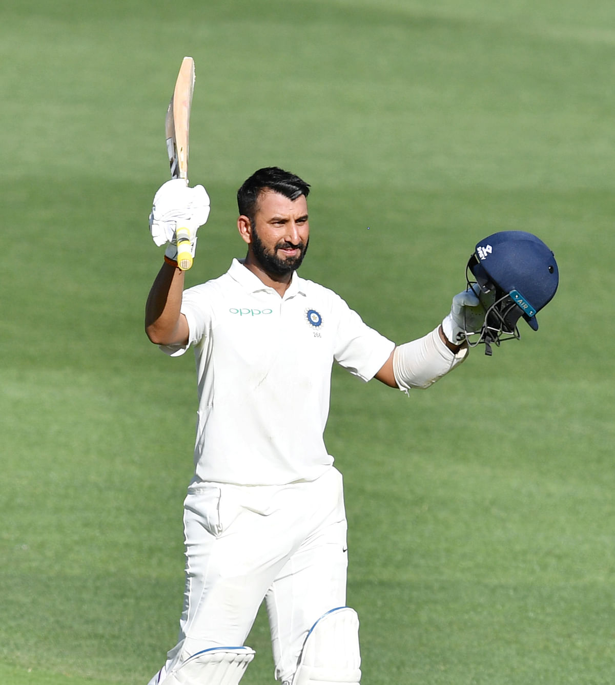 India`s Cheteshwar Pujara celebrates after scoring his century during day one of the first test match between Australia and India at the Adelaide Oval in Adelaide, Australia, on 6 December 2018. Photo: Reuters