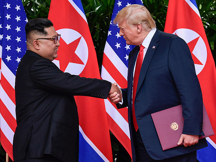 In this 12 June, 2018, file photo, North Korea leader Kim Jong Un, left, and US president Donald Trump shake hands at the conclusion of their meetings at the Capella resort on Sentosa Island in Singapore. Photo: AP