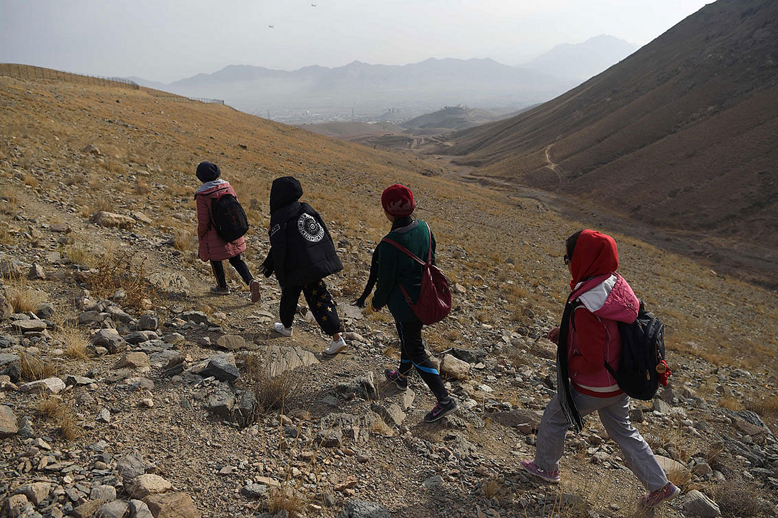 In this photo taken on 9 November 2018, Afghan members of the all-female Free to Run group hike during a training session at the Haje Nabi hilltop on the outskirts of Kabul. At Photo: AFP