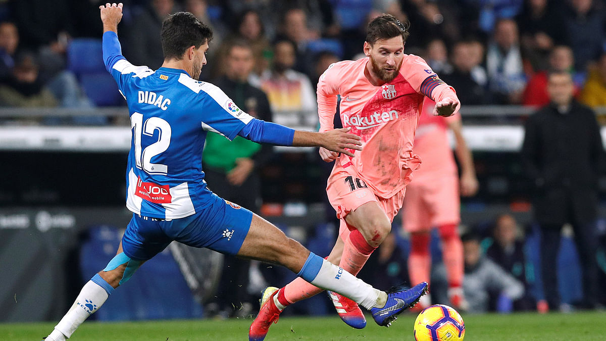 Barcelona`s Lionel Messi in action with Espanyol`s Didac Vila in a La Liga match at RCDE Stadium, Barcelona, Spain on 8 December 2018. Photo: Reuters