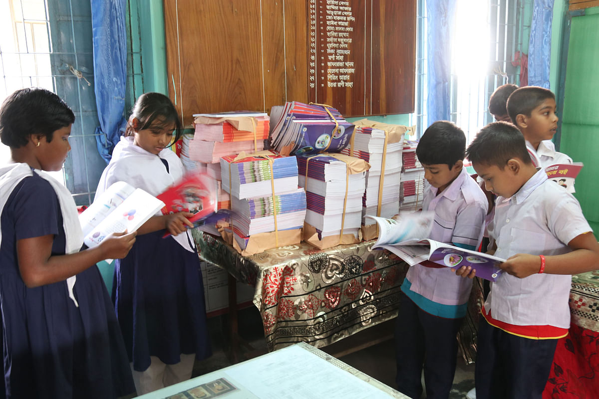 Students seeing their new textbooks piled in the library room of a local school to be distributed next year at Pashchim Khabaspur, Faridpur on 10 December. Photo: Alimuzzaman