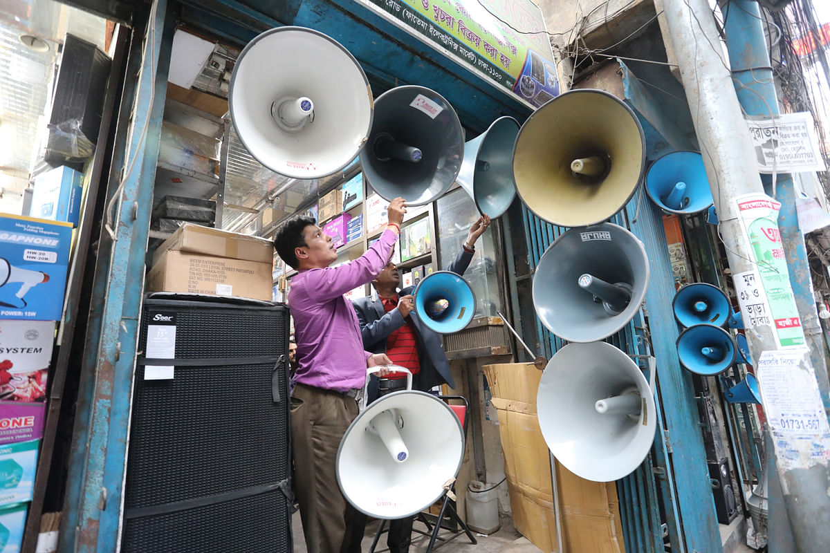 Sellers arranging microphones at Patuatuli, Dhaka on 10 December. Their demand is on the rise ahead of the upcoming parliamentary elections. Photo: Dipu Malakar