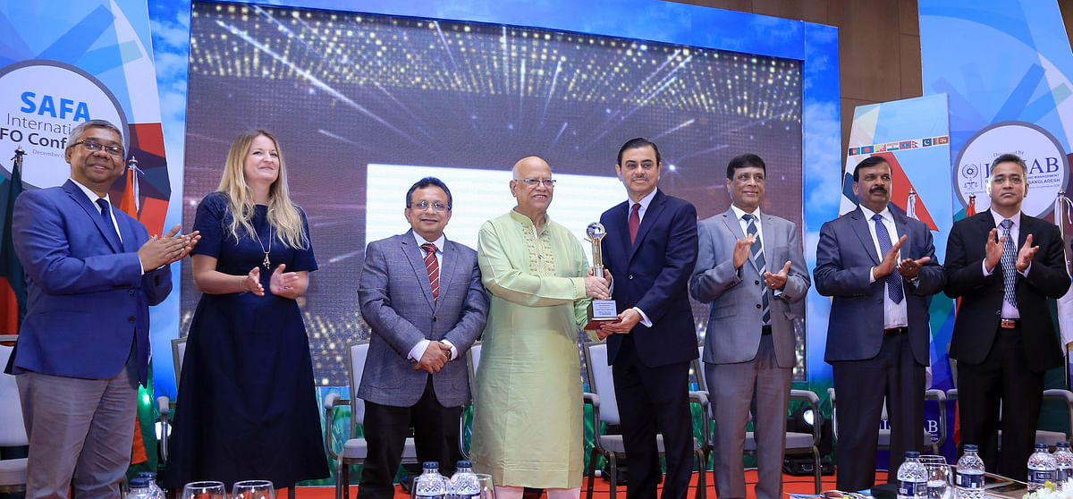 Finance minister AMA Muhith hands over ICMAB award to BRAC Bank managing director and CEO Selim RF Hussain