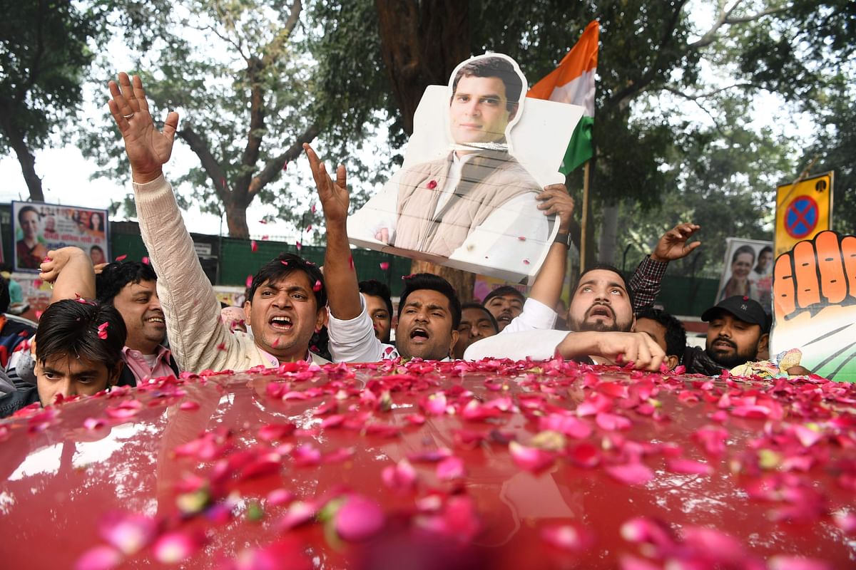 India`s Congress party supporters celebrate outside the party headquarters in New Delhi on 11 December, 2018, as vote counting in five Indian states began. Photo: AFP