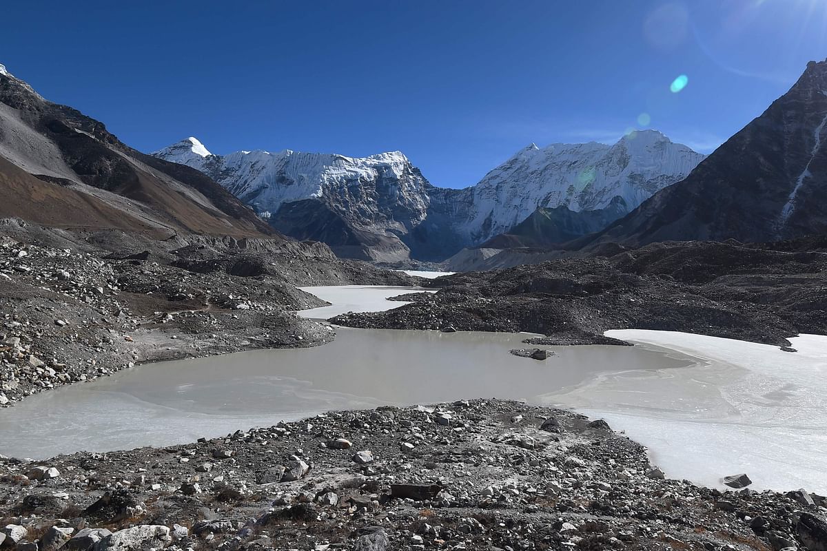 This picture taken on 22 November 2018 shows a general view of the Imja glacial lake controlled exit channel in the Everest region of the Solukhumbu district, some 140km northeast of Kathmandu. Formed in the shadow of Mount Everest, the turquoise depths of Nepal`s Imja glacial lake would be a breathtaking miracle of nature to behold -- were they not a portent of catastrophic floods. Photo: AFP  Saving off disaster in the shadow of Mount Everest