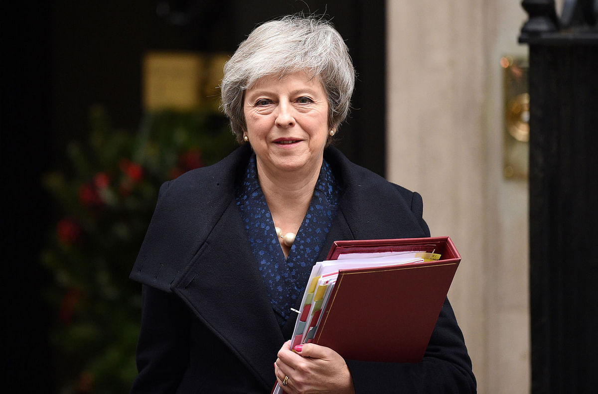 Britain`s Prime Minister Theresa May leaves 10 Downing Street in central London on December 12, 2018 ahead of the weekly question and answer session, Prime Ministers Questions (PMQs), in the House of Commons. British Prime Minister Theresa May was hit by a no-confidence motion by her own party on December 12 over the unpopular Brexit deal she struck with EU leaders last month. Facing her biggest crisis since assuming office a month after Britons voted in June 2016 to leave Europe, May vowed to fight the coup attempt inside her own Conservative Party `with everything I`ve got`. AFP