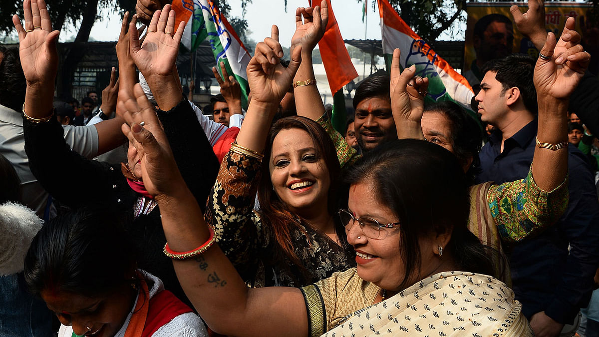 Indian Congress party supporters celebrate outside the party headquarters in New Delhi on 11 December 2018, as vote counting in five Indian states began. India`s ruling party looked set on 11 December for stinging election defeats in at least two stronghold states, in a big blow to Prime Minister Narendra Modi ahead of national polls in 2019. -- Photo: AFP