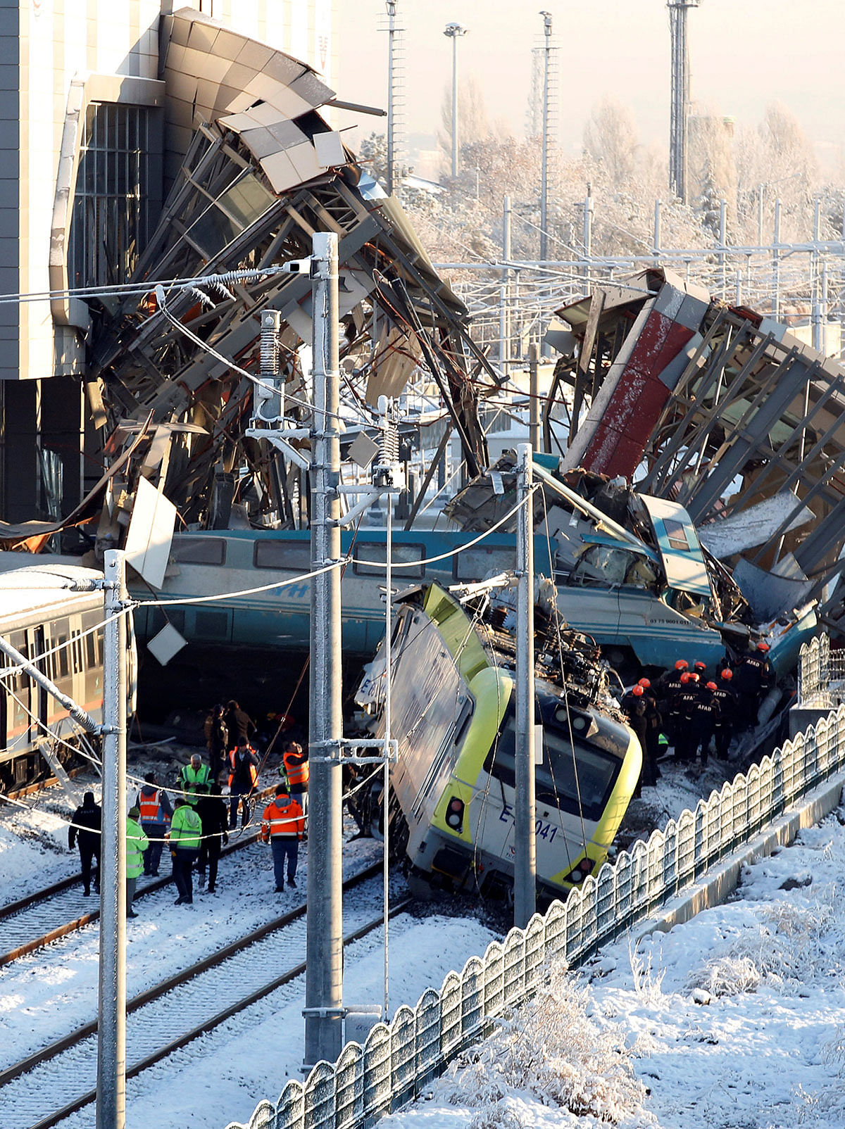 Rescue workers search at the wreckage after a high speed train crash in Ankara, Turkey on 13 December 2018. Photo: Reuters