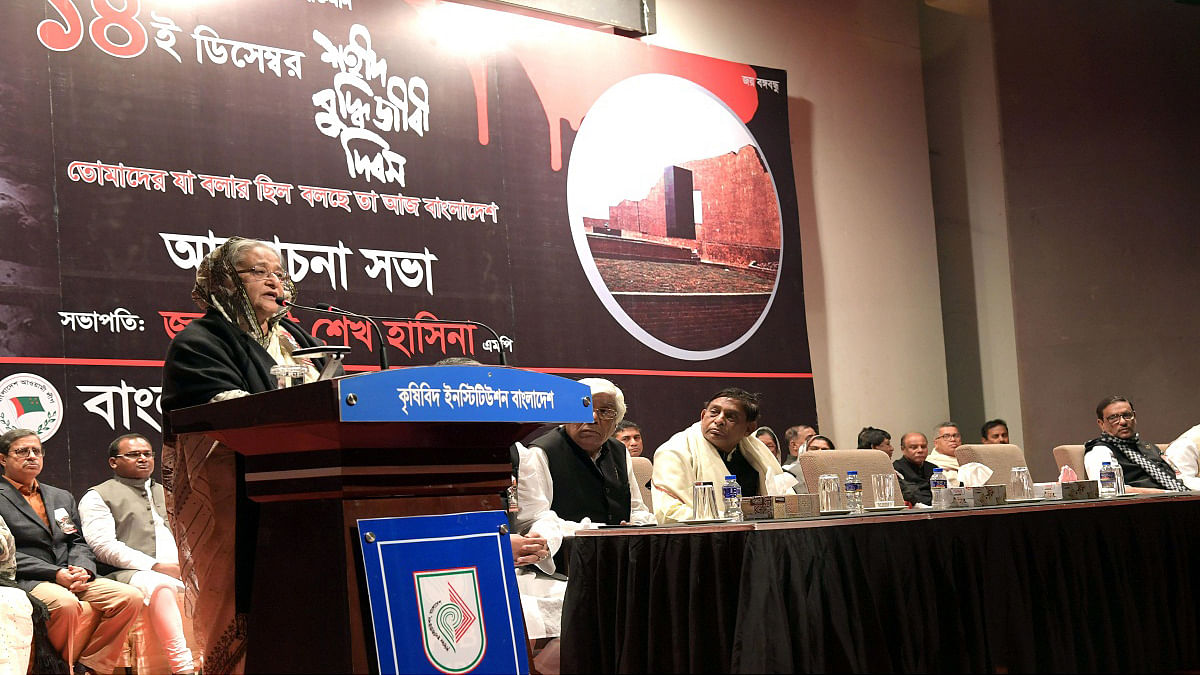 Prime minister Sheikh Hasina speaks at a programme arranged by Awami League at Bangladesh Krishibid Institution in the city on Friday to mark Martyred Intellectuals Day. Photo: PID