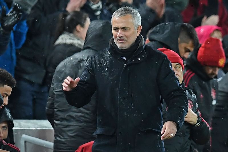 Manchester United`s Portuguese manager Jose Mourinho goes to shake hands with Liverpool`s German manager Jurgen Klopp after the English Premier League football match between Liverpool and Manchester United at Anfield in Liverpool, north west England on 16 December 2018. Photo: AFP