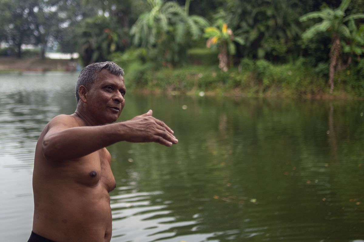 In this photograph taken on 4 October 2018, Bangladeshi swimmer Kshitindra Baisya prepares to swim in a lake in Dhaka. Photo: AFP