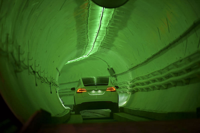 A modified Tesla Model X drives into the tunnel entrance before an unveiling event for the Boring Co. Hawthorne test tunnel in Hawthorne, south of Los Angeles on 18 December 2018. Photo: AFP