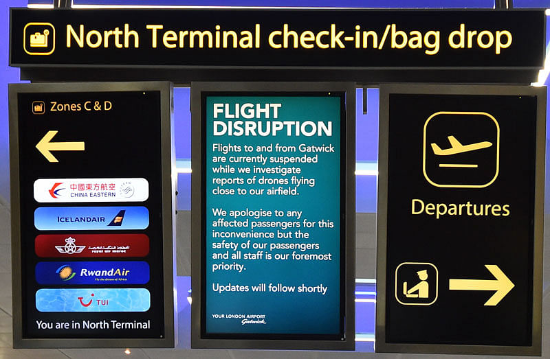 An information board announces flight disruption at London Gatwick Airport, south of London, on 20 December 2018 after all flights were grounded due to drones flying over the airfield. Photo: AFP
