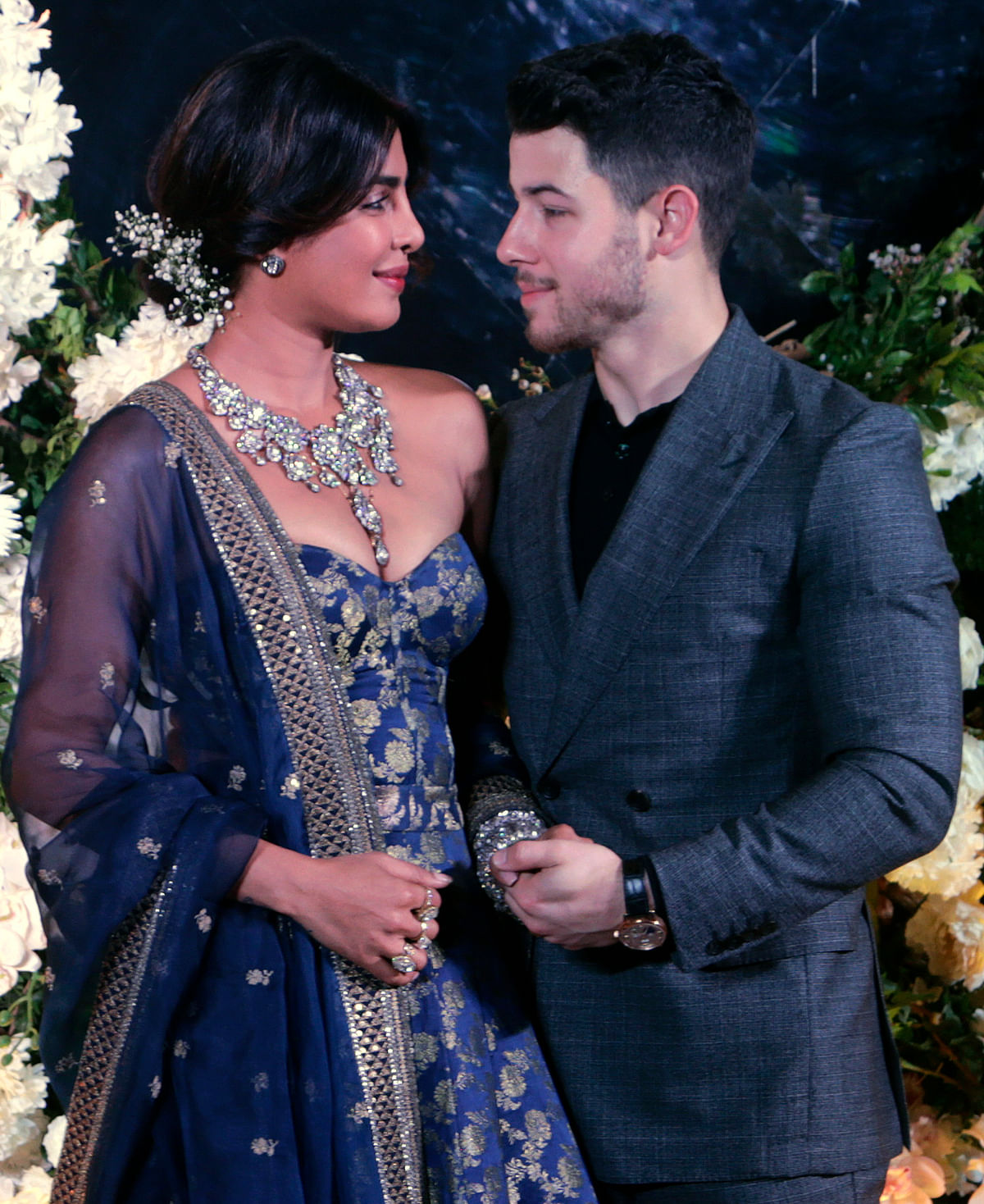 Bollywood actress Priyanka Chopra and musician Nick Jonas pose for photographs at their wedding reception in Mumbai, India, Wednesday, 19 December 2018. Photo: AP