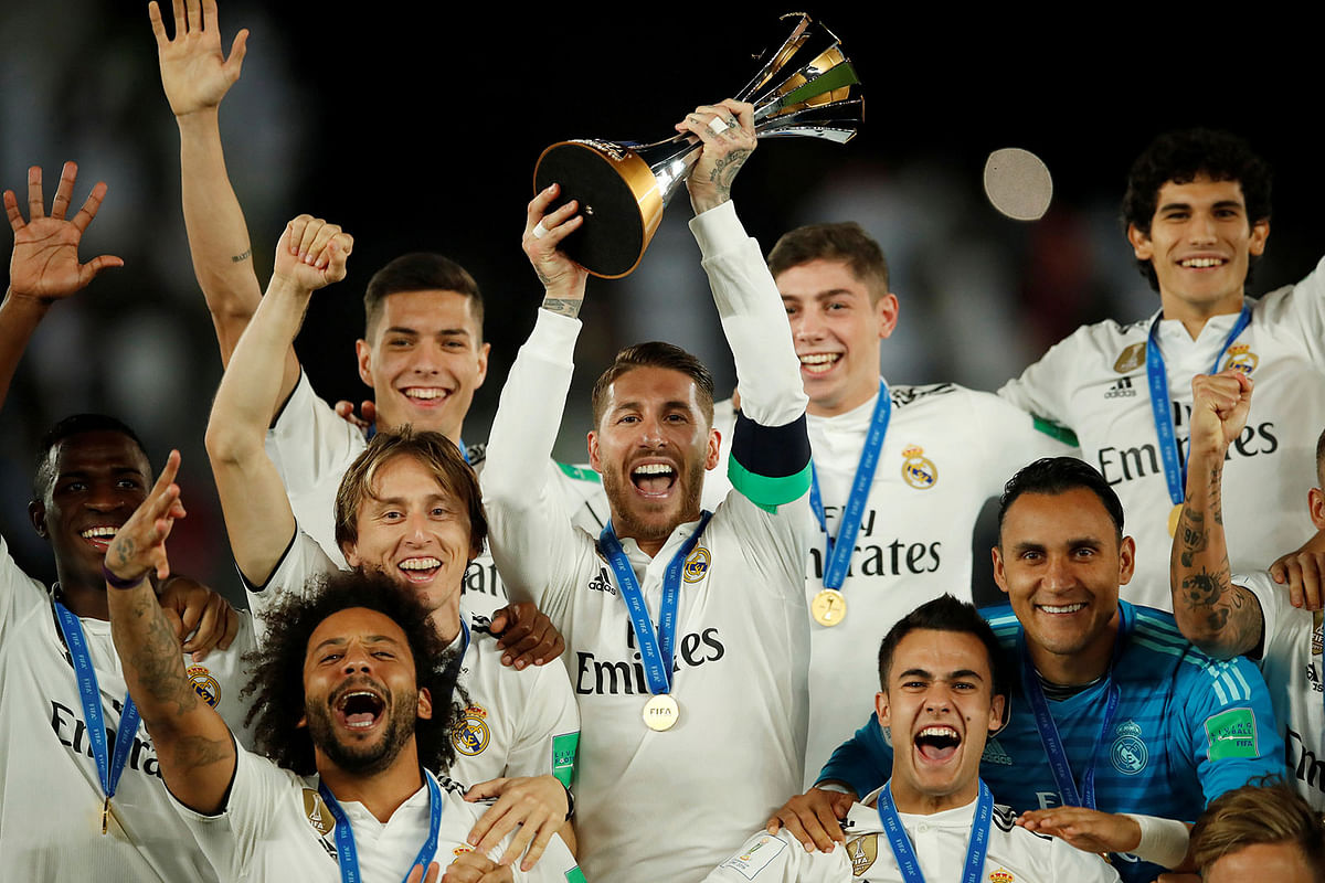 Real Madrid`s Sergio Ramos and team mates celebrate with the trophy after winning the Club World Cup. Photo: Reuters