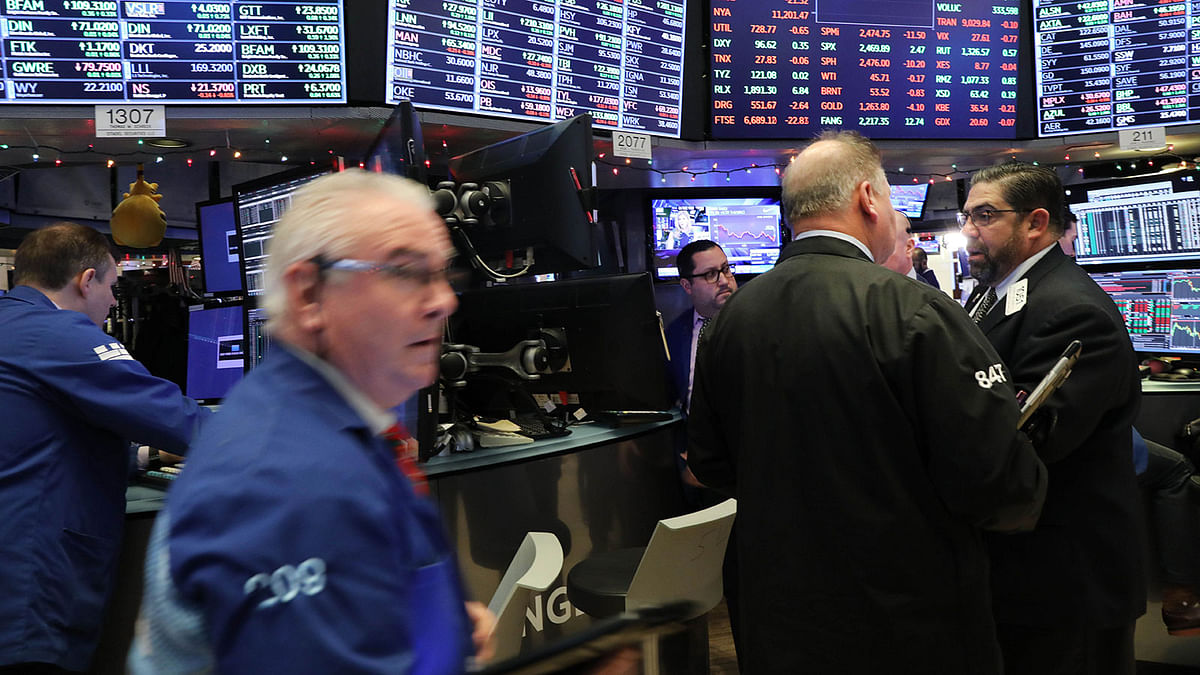 Traders work on the floor of the New York Stock Exchange (NYSE) on 21 December 2018 in New York City. Photo: AFP