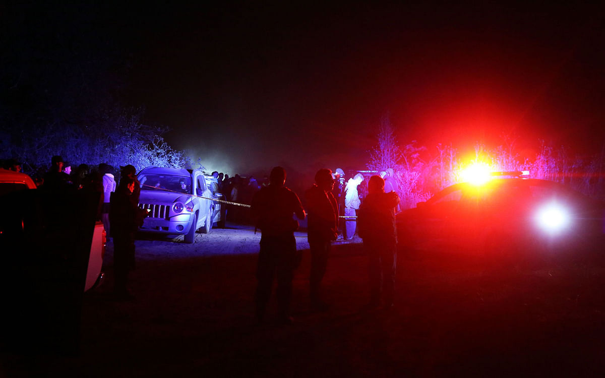 Members of Federal Police search the scene of a helicopter accident in which the governor of the Mexican state of Puebla, Martha Erika Alonso, and her husband, senator and former governor of the same region, Rafael Moreno, died when the chopper plummeted to the ground in San Pedro Tlaltenango after taking off from nearby Puebla, on 24 December 2018. The cause of the accident is still unknown. Photo: AFP