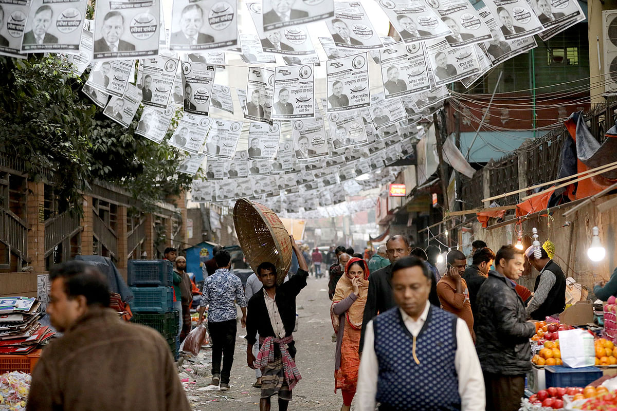 Posters of an election candidate are seen hanging above the street ahead of the 11th general election in Dhaka, Bangladesh, on 28 December 2018. Photo: Reuters
