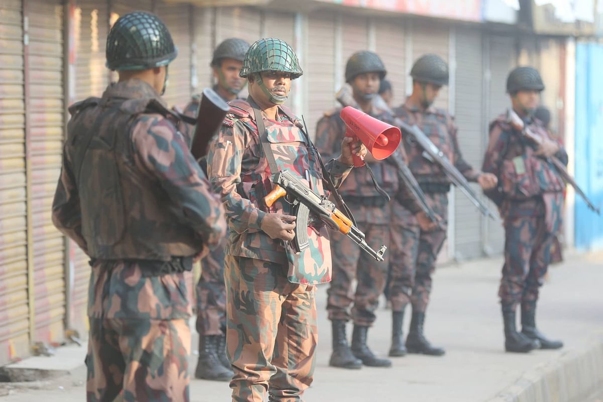 Law enforcement members on patrol at Shahjahanpur, Dhaka on 30 December. Photo: Abdus Salam
