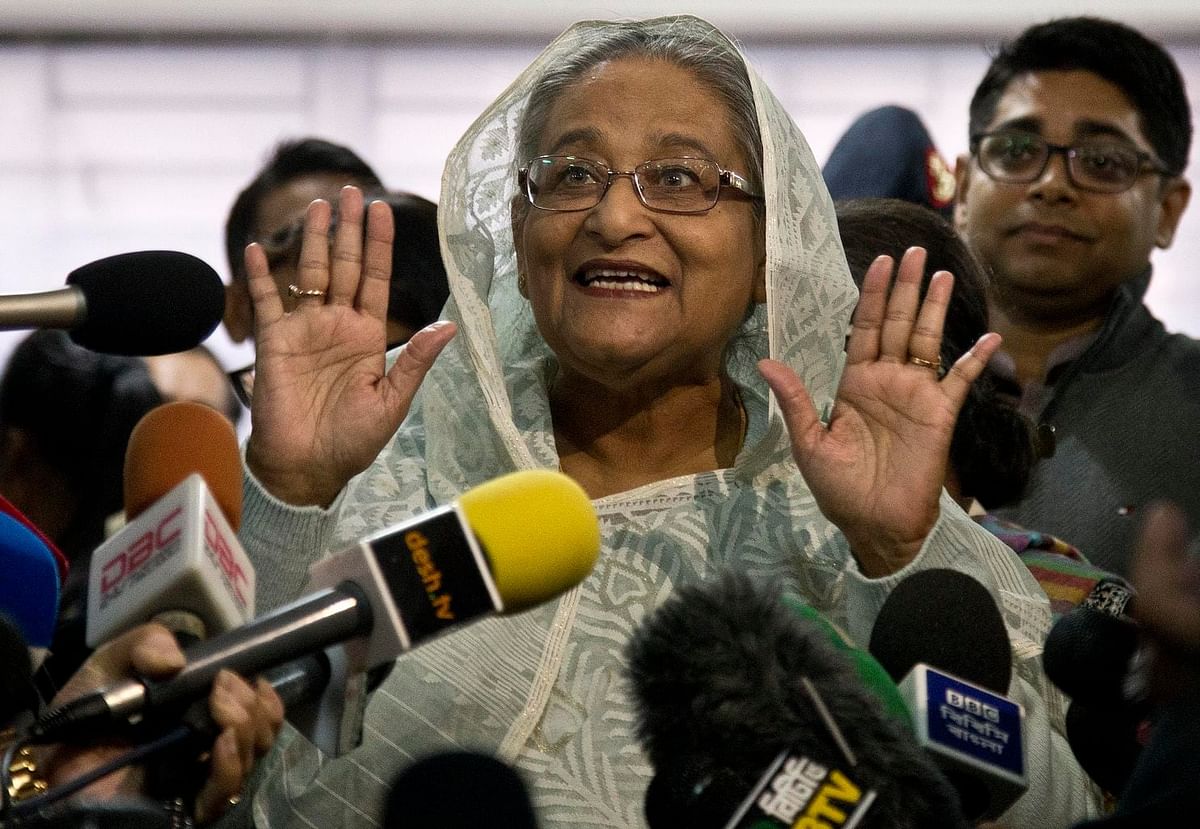 Prime minister Sheikh Hasina speaks to reporters after casting her vote in parliamentary elections in Dhaka, on Sunday.—Photo: AP