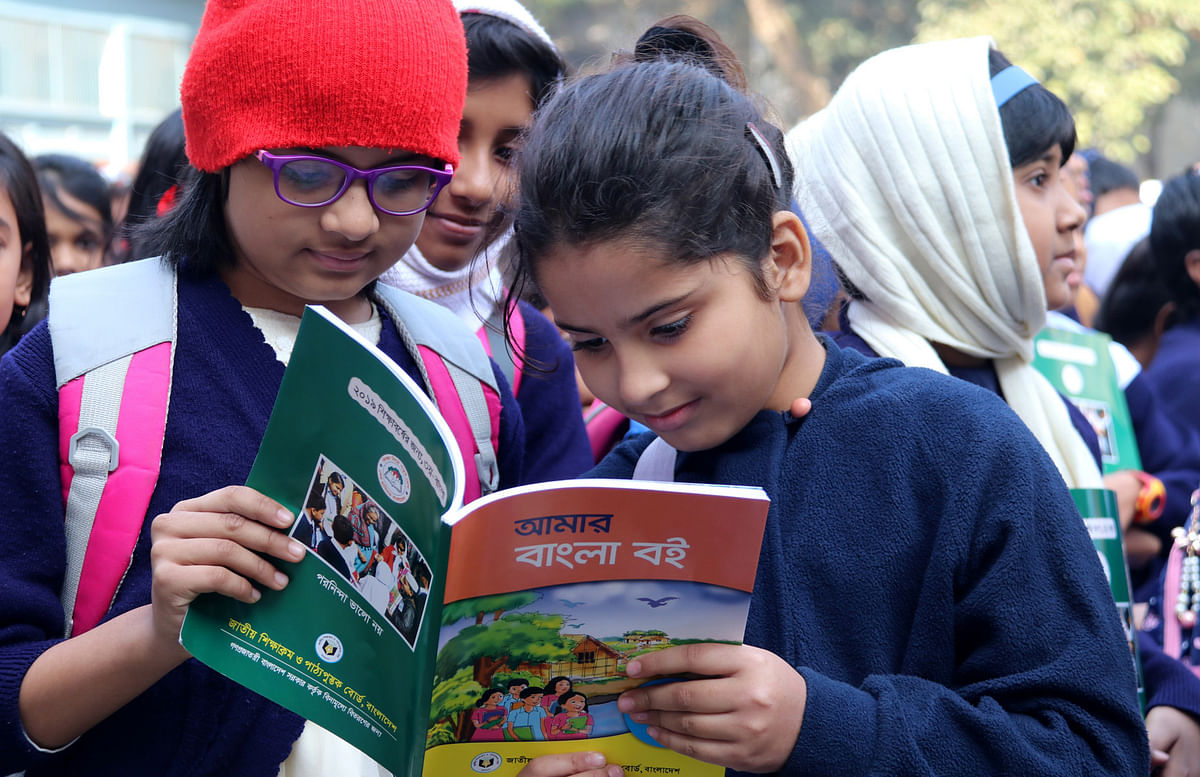 Children rejoice with new textbooks as they receive those in the Textbook Festival held countrywide on 1 January. Government Girls’ High School, Jashore. Photo: Ehsan Ud Doula