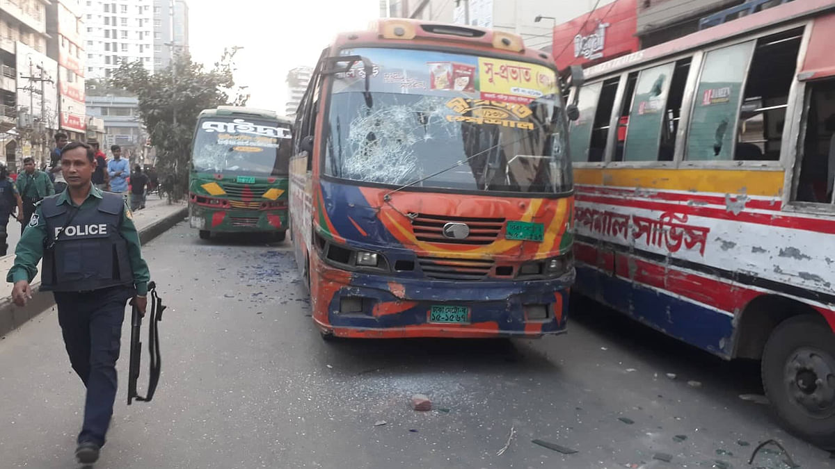 Agitated people vandalise several vehicles after two girls are killed as a passenger bus runs over them at Malibagh Chowdhurypara area in the city on Tuesday. Photo: Sajid Hossain