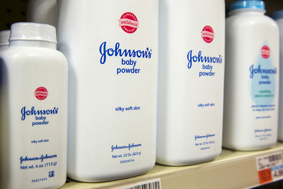 Bottles of Johnson & Johnson baby powder line a drugstore shelf in New York 15 October. Photo: Reuters