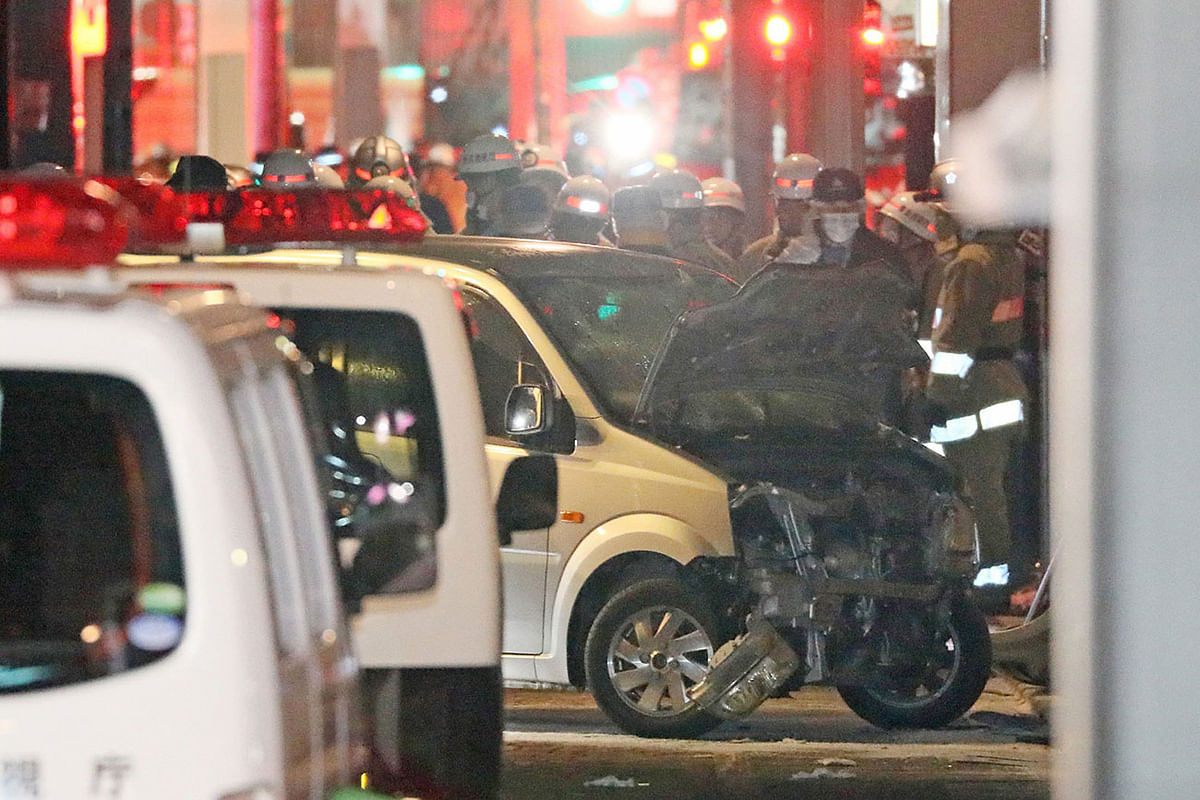 Police inspect a car whose driver rammed his vehicle into crowds on Takeshita street in Tokyo early 1 January 2019. Photo: AFP