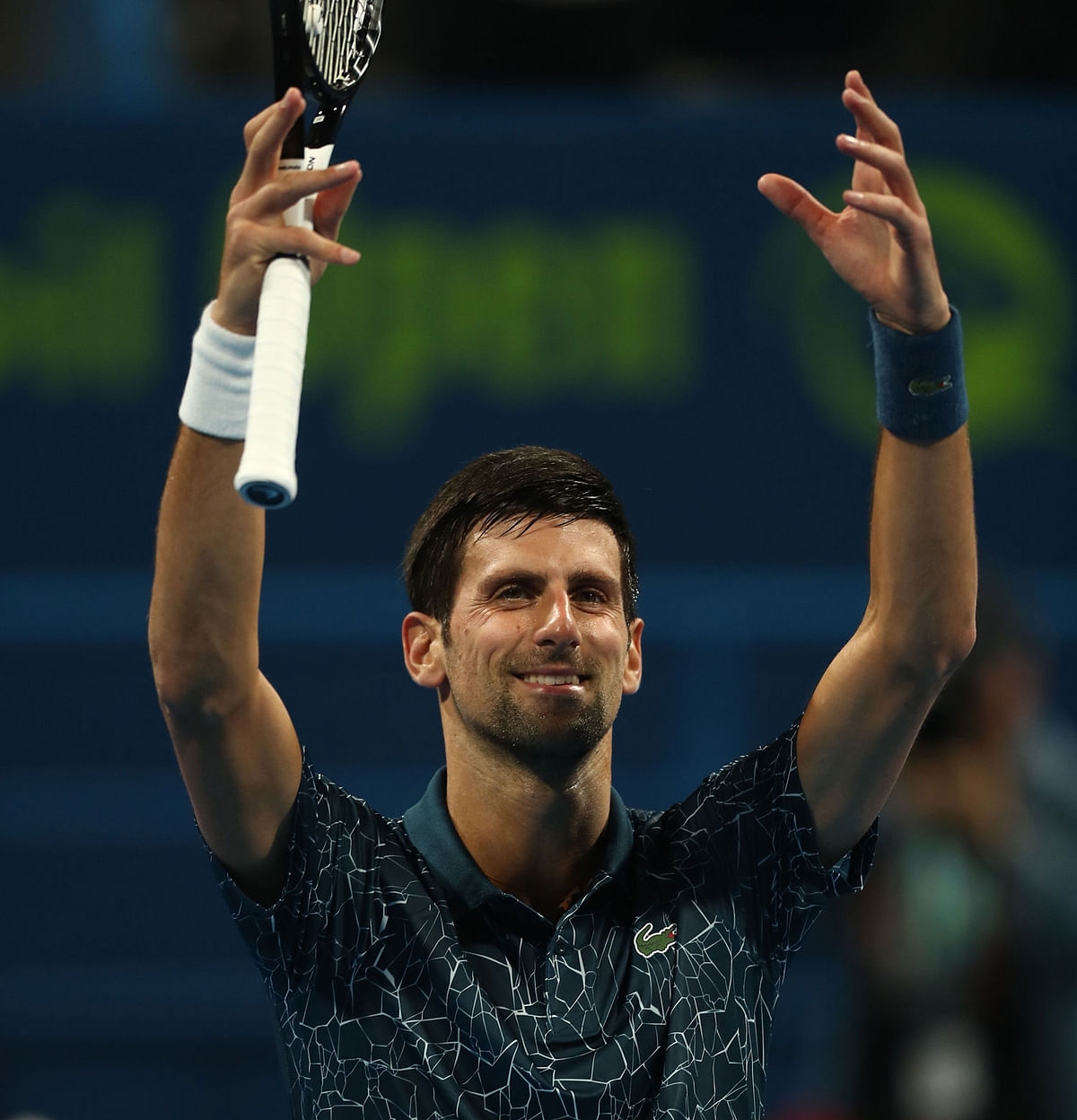 Serbia`s Novak Djokovic celebrates after winning against Bosnia and Herzegovina`s Damir Dzumhur during the ATP Qatar Open tennis competition`s first round in Doha on 1 January 2019. Photo: AFP