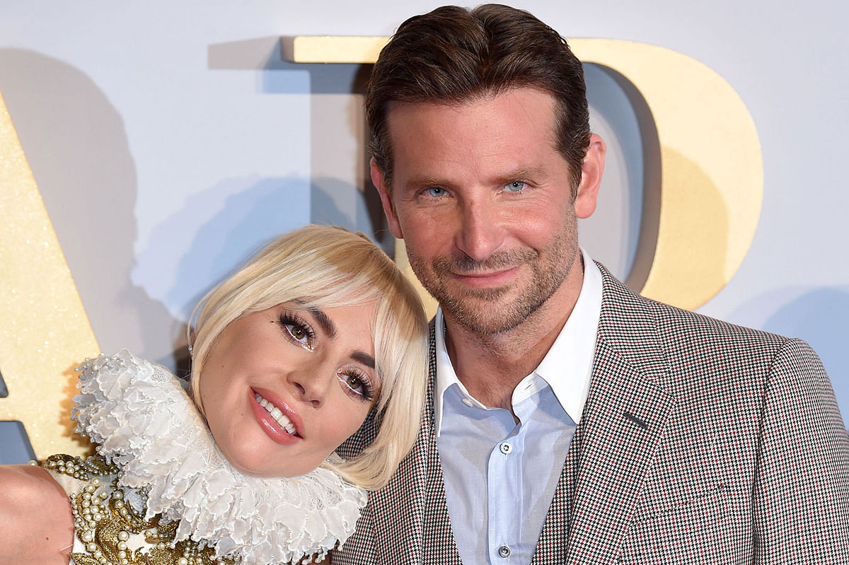 In this file photo US singer/actress Lady Gaga (L) and US actor/director Bradley Cooper pose on the red carpet upon arrival for the UK premiere of the film `A Star is Born` in central London on 27 September 2018. Photo: AFP