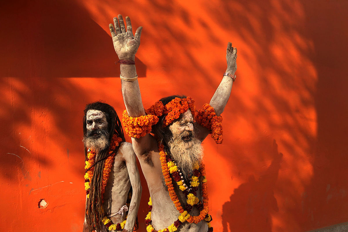 Naga Sadhus, or naked Hindu holy men shout slogans during a religious procession towards the Sangam, the confluence of rivers Ganges, Yamuna and mythical Saraswati, as part of the Kumbh festival in Allahabad, India,on 4 January. Photo: AP